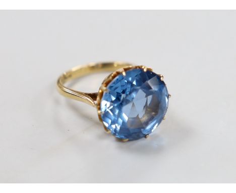 An 10k and blue paste? set ring, size K/L, gross weight 7 grams.