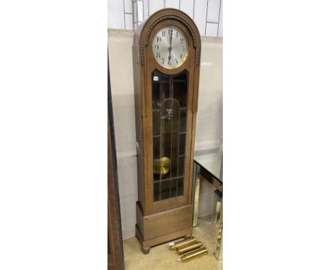 A 1920's oak cased 8 day longcase clock, height 192cm