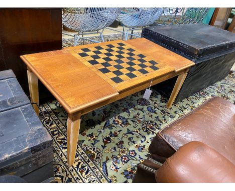 A modern teak hinged top low games table, with backgammon and chess surfaces, width 98cm, depth 50cm, height 43cm