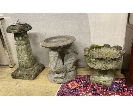 A reconstituted stone sundial, height 73cm, a pelican bird bath and a circular acanthus planter