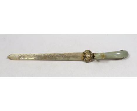 A Chinese celadon jade belt hook handled paperknife, the 19th century belt hook 8.2 cm long, total length 26.5 cm