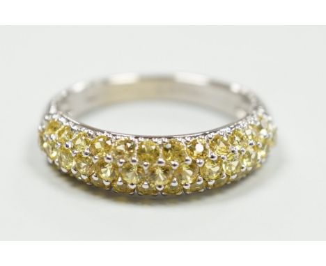 A modern 18ct white gold and yellow stone cluster set half hoop ring, size K, gross weight 4.2 grams.