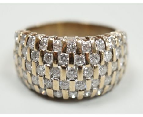 A modern yellow metal and pave set five row diamond dress ring, size R, gross weight 9.2 grams.