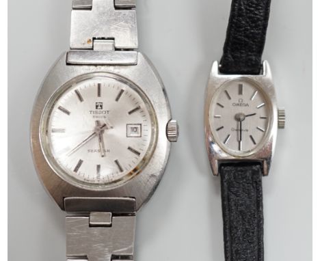 A lady's stainless steel Omega manual wind wrist watch, case diameter 16mm, with Omega box and a similar Tissot wrist watch.