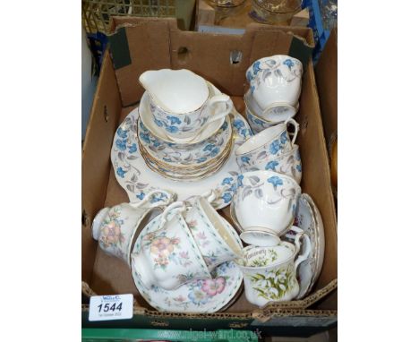 A Royal Albert 'Morning Glory' part tea set to include six cups and saucers, jug sugar bowl, and bread and butter plate toget