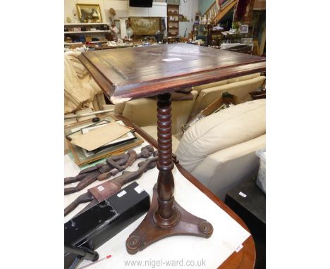 A square Oak occasional Table, the top with inlays of parquetry type with ebony banding, standing on a turned pillar and with