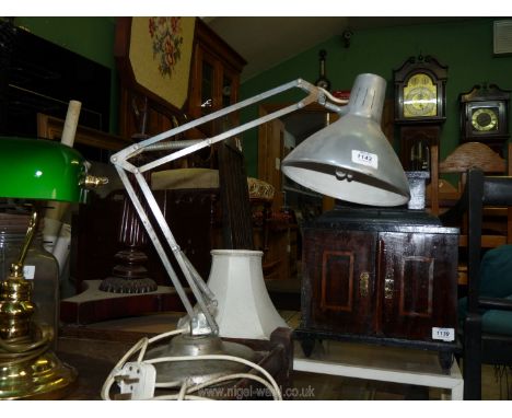 A grey '1001 Lamps Ltd' angle poise lamp.
