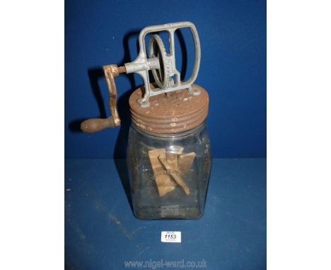 A glass butter Churn with wooden paddles, metal lid, (3 imperial quarts) 14" high.