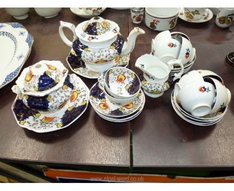 A Gaudy Welsh china Teaset with eight cups, twelve saucers, teapot, jug, sugar bowl with lid (damaged) and two plates, some a