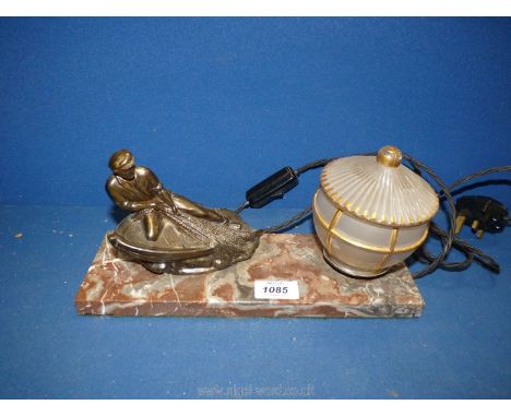 An Art Deco style desk Lamp having a marble base and a spelter figure of a fisherman and with opaque shade, 11 1/2" x 4". (wo