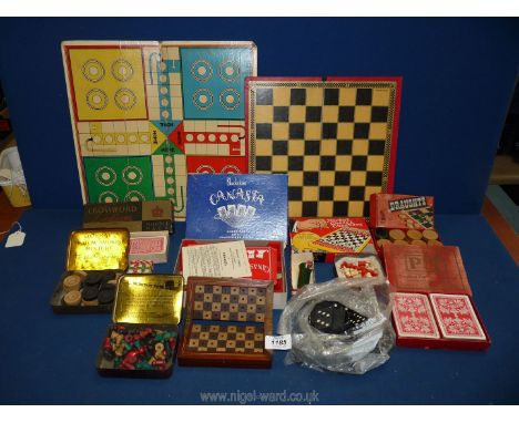 A box of miscellaneous games including wooden draughts, crossword lexican, pocket chess &amp; checkers, canaster dominoes, et