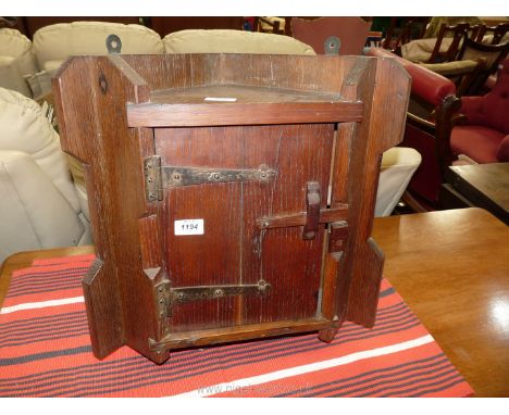 A rustic Oak wall hanging Corner Cupboard haivng nicely detailed strap hinges, a wooden Suffolk type door latch, the interior