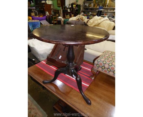 A surprisingly heavy Cuban Mahogany circular occasional Table standing on turned pillar with three elegant splayed feet, 20''