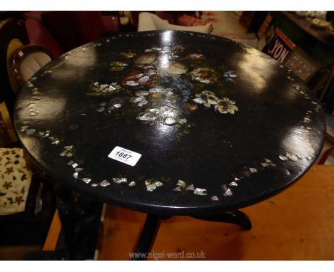 A circular occasional Table, the black lacquered top with polychrome illustration of naturalistic flowers with mother of pear
