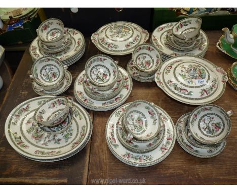 A quantity of 'Indian Tree' Johnson Bros dinnerware to include; two meat plates, two lidded tureens, sixteen soup coups and s