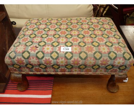 A rectangular Stool having brief cabriole legs and geometric patterned tapestry upholstery, 14'' x 19 1/2'' x 9 1/2'' high.