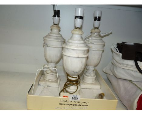 Three alabaster lamp bases.
