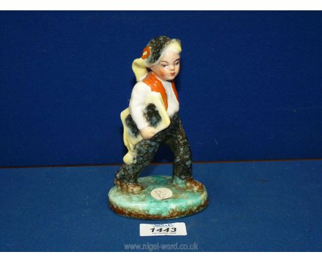 A rare vintage 1930's Ditmar Urbach ceramic figure of a boy carrying a book from Czechoslovakia, 6 1/4 tall.