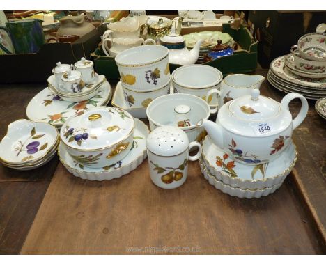 A good quantity of Royal Worcester Evesham including oval plates, flan dish, souffle dishes, tea pot, small tureen, jug, etc.
