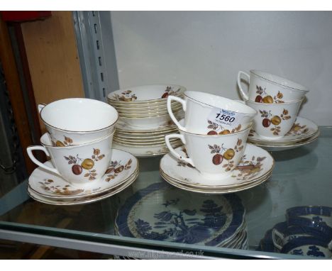 A part Royal Worcester Teaset in cream with brown and gilt fruit decoration comprising of six cups and saucers, bowls and cak