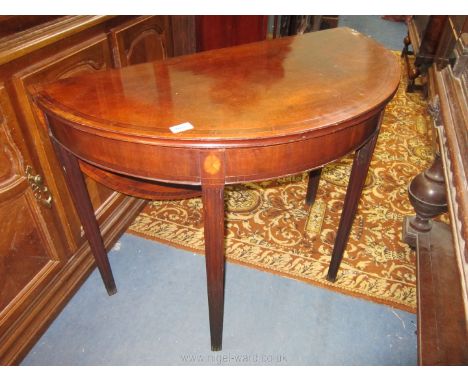 An unusual circa 1900 semi-circular Side Table having light and darkwood strung and cross-banded top and unusually with a rea