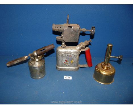 Three Blow lamps including an unnamed polished brass vertical burner lamp, a ''Valtock No. 3 - made in Great Britain'' and a 