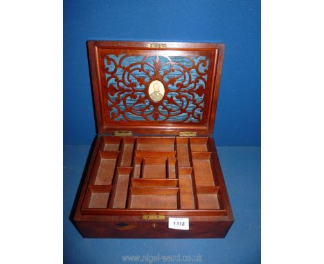 A parquetry jewellery box with interior lift out shelf and various compartments, a blue silk lining to lid with fretwork over