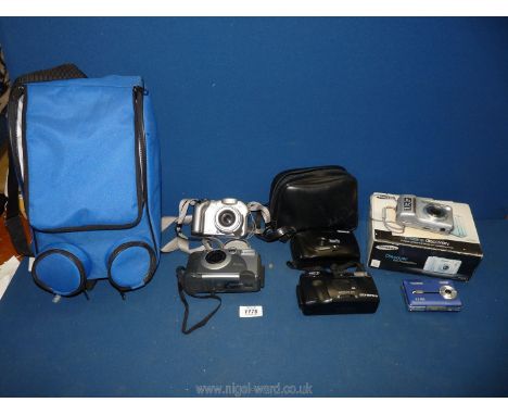 A quantity of cameras including Kodak, Technika, Panaroma, Canon Powershot in blue carrying case.