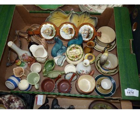 A quantity of small china ornaments including Poole seals, Wade log, Torquay pottery, cups and saucers, Sylvac ware martingal