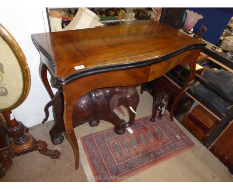 A 19th century serpentine fronted cross-banded and checked strung mixed woods flap over Card Table standing on elegant swept 
