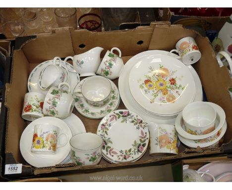 A Wedgwood part tea set in 'Summer Bouquet' pattern to include three cups, six saucers, six side plates and three large plate