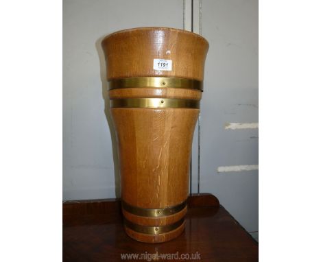 A cooper made and wood turned Umbrella/stick Stand in light oak with brushed finish brass bands, 19'' high x 10 3/4'' diamete