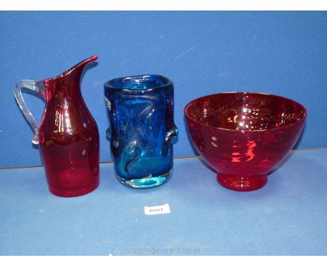 Whitefriars ruby red glass jug with clear handle, together with a dark blue bark effect vase and a cranberry glass dish.