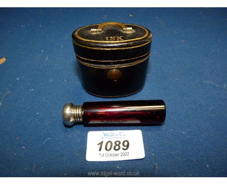 A ruby glass perfume bottle with silver top, Birmingham hallmark, 2 1/2'' long and an oval leather cased travel inkwell, in t