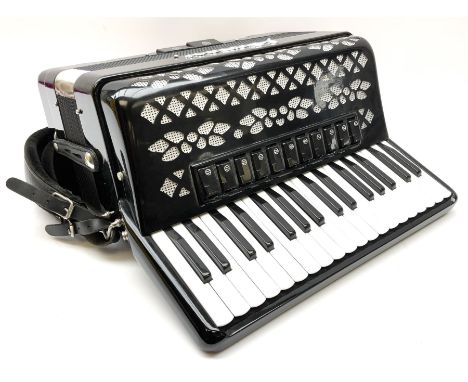 Italian E. Soprani piano accordion in black and silver case, twenty keys and seventy-two buttons L41cm; in soft carrying case