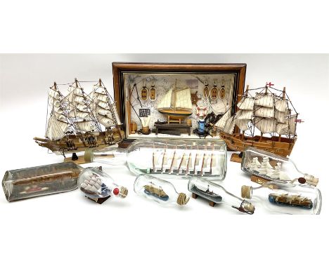 Seven ships in bottles, to include Wavertree sailing ship, a three masted ship and a tugboat, together with small scale model