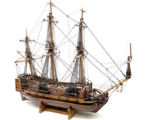 Kit built model of a three masted sailing ship, with rigging, upon a wooden stand, L69cm, H63cm