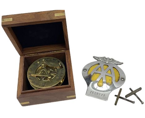 Nautical brass sundial compass marked F. L. West, London, with wooden box, and a vintage AA car badge (no. 2E28777)