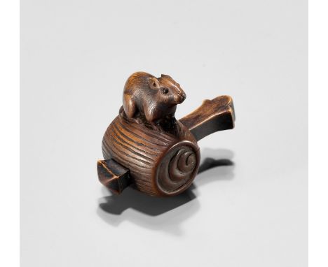A WOOD NETSUKE OF A RAT ON DAIKOKU'S WISH-GRANTING MALLETUnsignedJapan, 19th centuryFinely carved as a large rat with neatly 