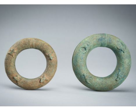 A PAIR OF BRONZE 'FROG AND BULL' RITUAL BANGLES, DONG SON STYLEVietnam, 20th century or earlier. Each of circular form, the t