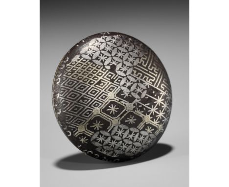 A RARE SILVER-INLAID IRON MANJU NETSUKEUnsignedJapan, 18th-19th century, Edo period (1615-1868)Of circular form, the two-part