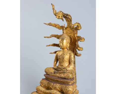 A GILT-BRONZE FIGURE OF BUDDHA MUCHALINDA SURROUNDED BY NAGA, 19TH CENTURYThailand, Rattanakosin Kingdom (1782-1932). Cast se