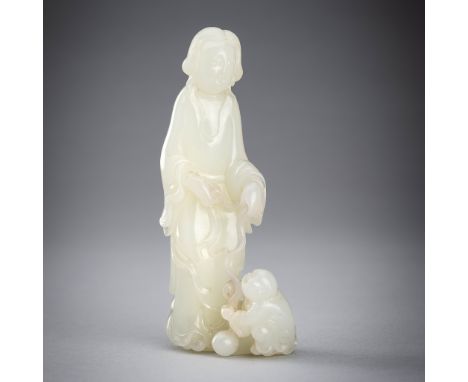 A PALE CELADON JADE GROUP OF A FEMALE IMMORTAL AND BOY, c. 1920sChina, late Qing dynasty (1644-1912) to Republic period (1912