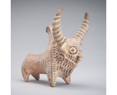 A PAINTED TERRACOTTA FIGURE OF A ZEBU, MATURE HARAPPAN PERIOD, 2600-1900 BCIndus Valley Civilization. The humped bull standin