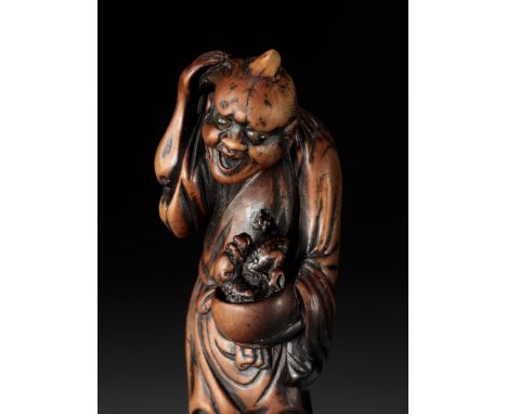 A REMARKABLE TALL WOOD NETSUKE OF CHINNAN SENNIN WITH DRAGON, ATTRIBUTED TO SOSHINAttributed to Soshin, unsignedJapan, Osaka 