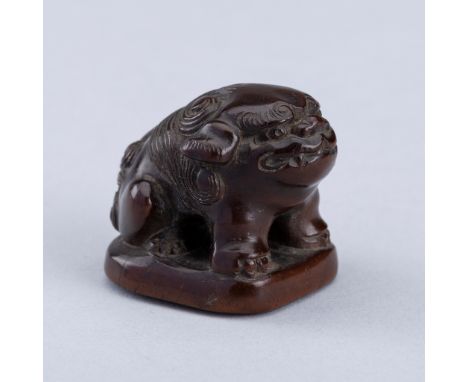 TAMAYA: A WOOD NETSUKE OF A SHISHI, EDO PERIODBy Tamaya, signed TamayaJapan, 19th century, Edo period (1615-1868)Boldly carve