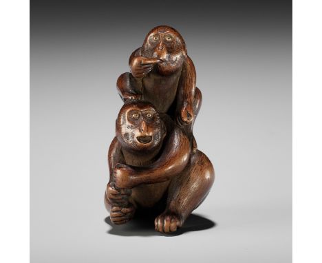 A WOOD NETSUKE OF TWO MONKEYSUnsignedJapan, first half of 19th century, Edo period (1615-1868)Finely carved as two monkeys, o