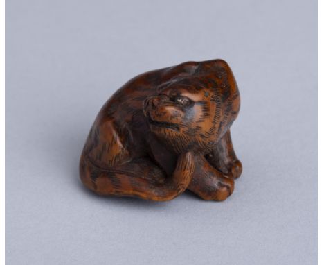 MASANAO: A WOOD NETSUKE OF A SNARLING TIGER, EDO PERIODBy Masanao, signed Masanao 正直Japan, Ise-Yamada, mid-19th century, Edo 