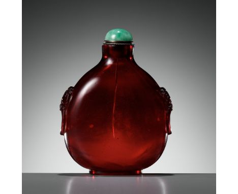 A RUBY-RED GLASS SNUFF BOTTLE, QIANLONG MARK AND PERIOD 乾隆款和年代寶石紅色料鼻煙壺China, 1736-1795. Of compressed globular form, supporte