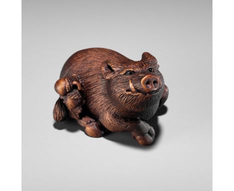 ALEXANDER DERKACHENKO: A BOXWOOD NETSUKE OF A BOAR WITH ACORNSBy Alexander Derkachenko, signed with the artist's signature Uk